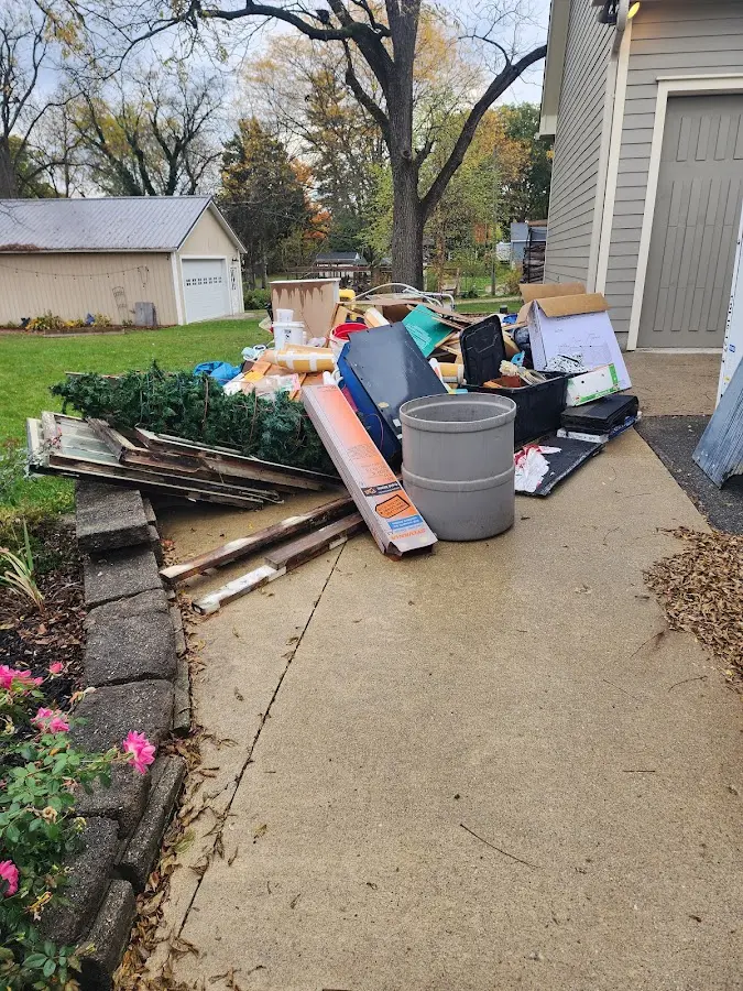 Dumpster being loaded with debris for 3 Yard Dumpster Rental in Rosewood Heights